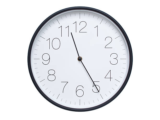 istock Simple wall clock with black frame and white face displaying 11:25 or 23:25. Ideal for time, schedule, and punctuality themes. 2209850675