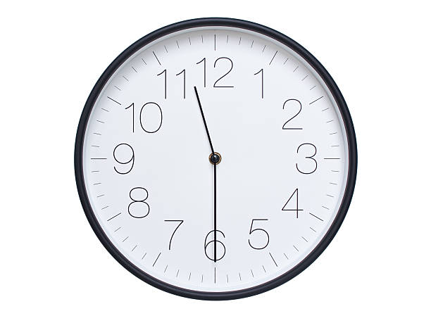 istock Simple wall clock with black frame and white face displaying 11:30 or 23:30. Ideal for time, schedule, and punctuality themes. 2209850691