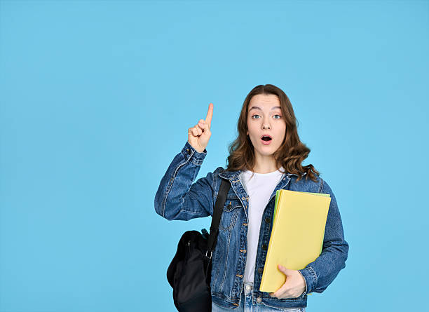 istock A student girl is looking at her phone. 2209862503