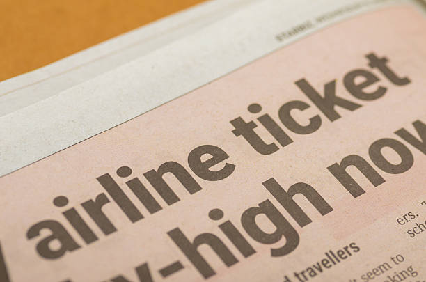 istock Rising Airline Ticket Prices Highlighted in Bold Newspaper Headline 2209865037