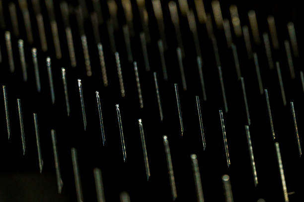 a  macro sharp metal teeth, total black background, closeup steel metal triangles, metalworking industrial screensaver,