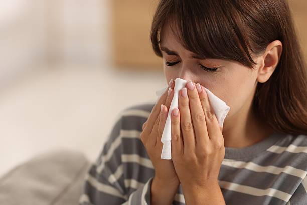 istock Woman with napkin suffering from sinusitis at home. Space for text 2209869541