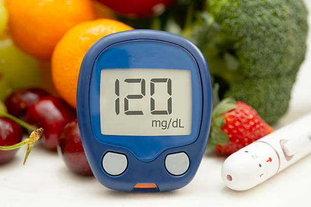 istock Glucose meter with vegetable and fruit for check sample blood sugar level to treatment diabetes. 2209871835