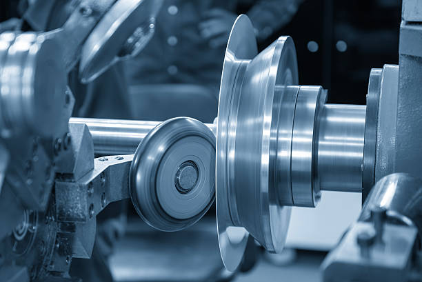 istock Close up scene the metal spinning process by lathe machine in the light blue scene. 2209893141