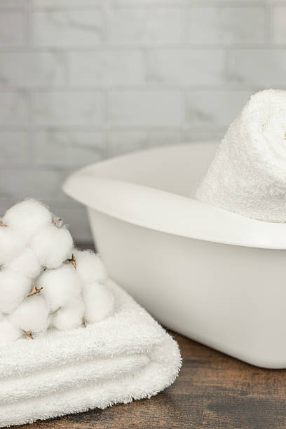 istock Clean, washed white towels. Laundry at home. Towels 2209895771