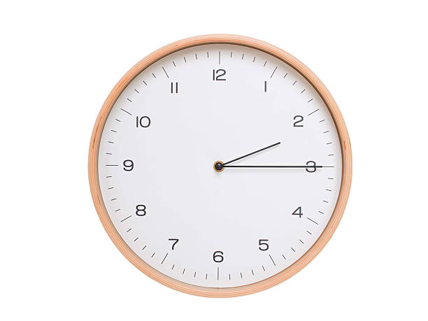 istock Minimal wall clock with light wood frame and white face displaying 02:15 or 14:15. Perfect for clean, modern concepts about time and scheduling. 2209902387