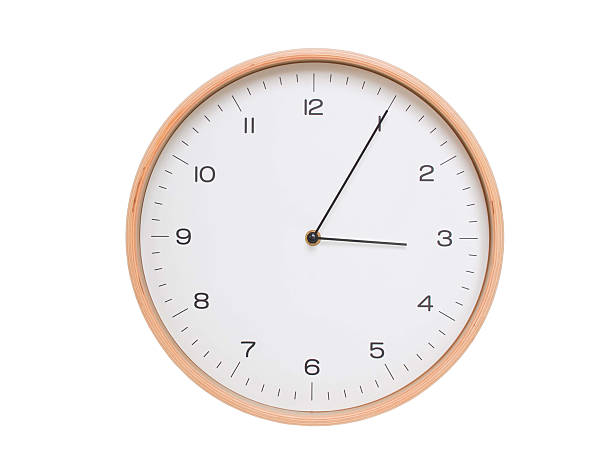 istock Minimal wall clock with light wood frame and white face displaying 03:05 or 15:05. Perfect for clean, modern concepts about time and scheduling. 2209902439