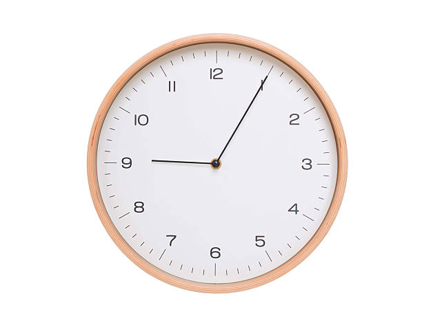istock Minimal wall clock with light wood frame and white face displaying 09:05 or 21:05. Perfect for clean, modern concepts about time and scheduling. 2209903070