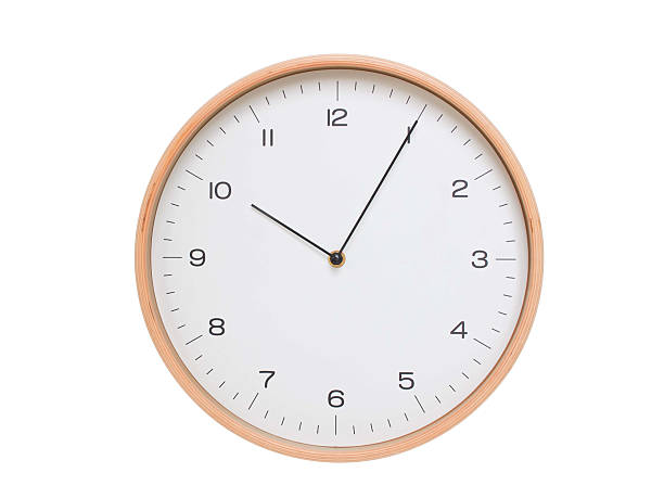istock Minimal wall clock with light wood frame and white face displaying 10:05 or 22:05. Perfect for clean, modern concepts about time and scheduling. 2209903132