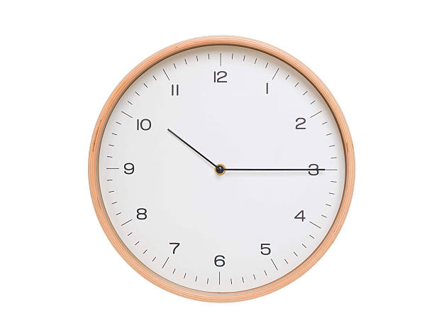 istock Minimal wall clock with light wood frame and white face displaying 10:15 or 22:15. Perfect for clean, modern concepts about time and scheduling. 2209903142