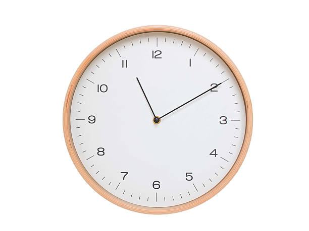 istock Minimal wall clock with light wood frame and white face displaying 11:10 or 23:10. Perfect for clean, modern concepts about time and scheduling. 2209903181