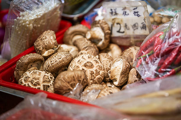 Fresh mushrooms sales on local market stall.