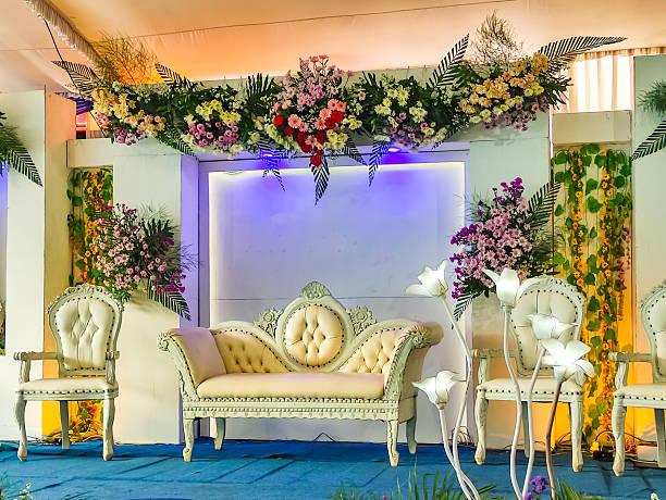 istock Luxurious Wedding Event Stage Decorated with Flowers and Elegant Seating Arrangement 2209912531