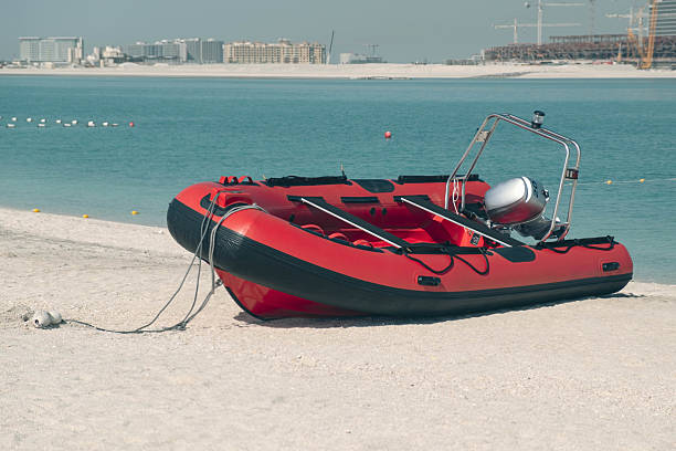 istock Inflatable Motorboat on Sandy Beach by Calm Sea 2209915593