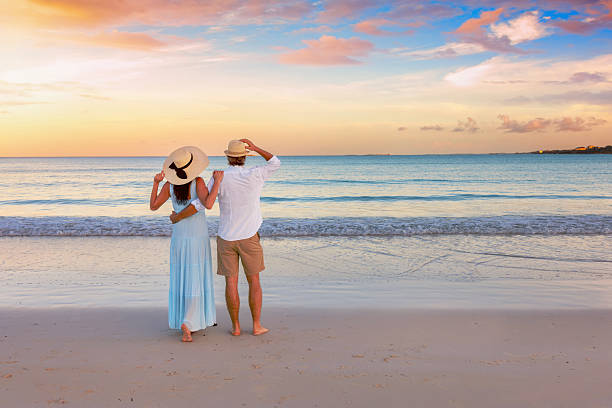 istock A hugging, romantic couple on vacation stands on a tropical paradise beach 2209917715