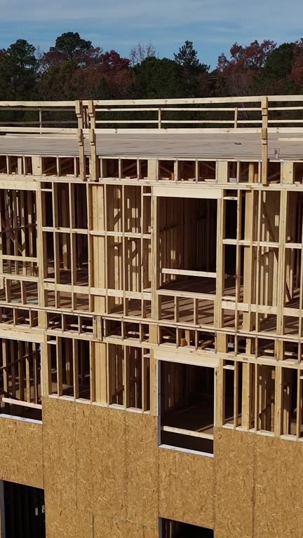 Wooden house framing under construction in USA. Vertical video