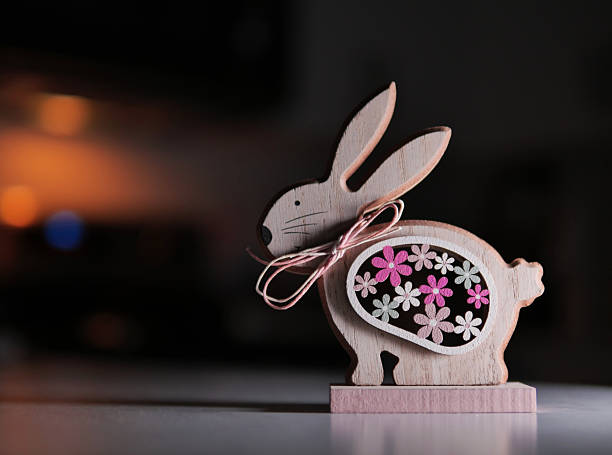 Cute Easter Bunny wooden figure on a kitchen counter with nice bokeh.
