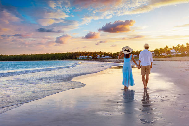 istock A beautiful couple on vacations walks down a tropical beach 2209919645