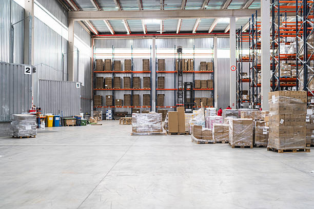 istock Cardboard boxes on pallets waiting to be shipped in distribution warehouse 2209923261