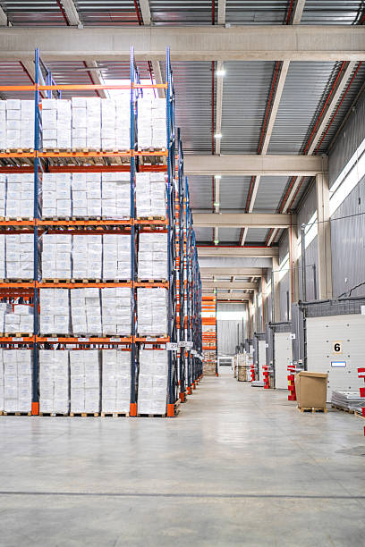 istock Logistic warehouse storing goods on tall shelves 2209923462