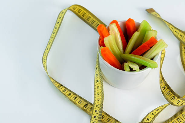 A bowl with celery and carrot sticks, healthy snack snacks, weight loss menu