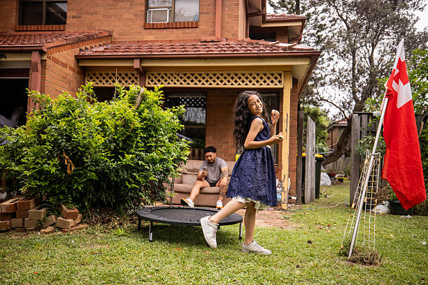 Sweet young girl having fun playing in the back yard.