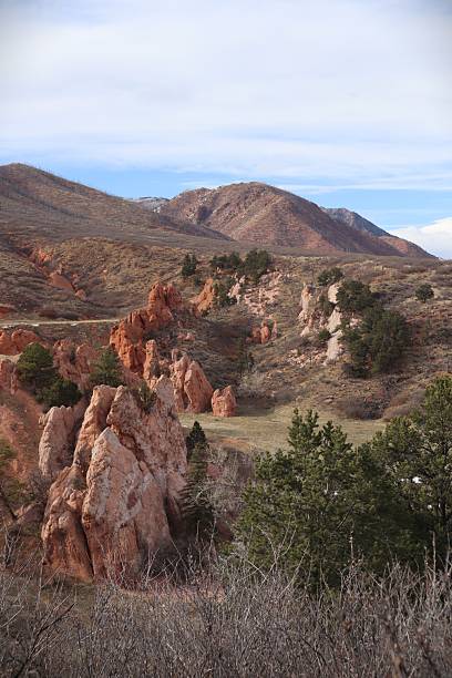 istock Line of Rock Formations Among Mountains 2209929374