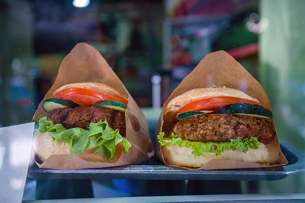 Tasty Meat burger   with tomatos, cucumber and salad and bread in  Washington DC  or  Chicago or Miami or Los Angeles