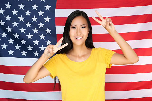 istock Young woman on American flag background 2209929618