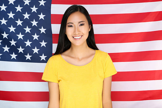 istock Young woman on American flag background 2209929917