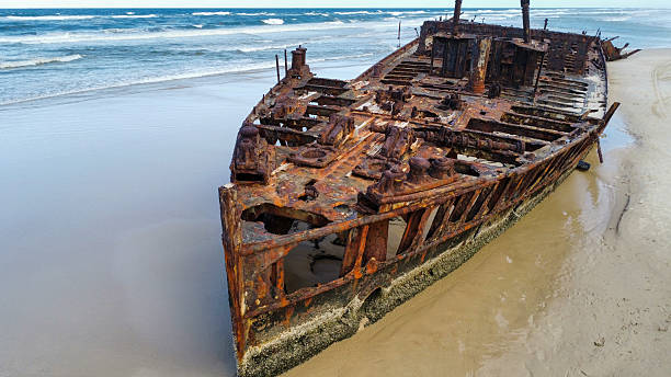 istock A washed up shipwreck on a sandy beach, seen from above 2209940251