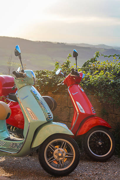 Red scooter and Roman wall, Rome Italy