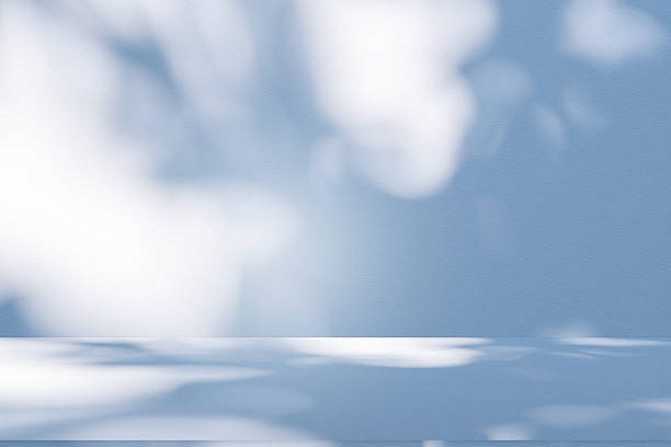 istock Studio style background wall decoration presentation uses white and blue tones. with shadows cast from a nearby window, concept creating a decorative 2209969759