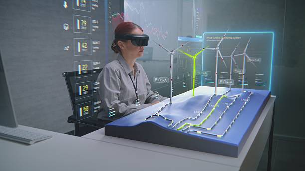 istock Advanced Office: Female Professional Uses Augmented Reality 3D Hologram to Visualize Wind Farm 2209976038