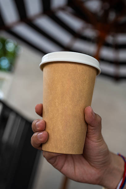 istock Brown paper cup with white lid 2210000793