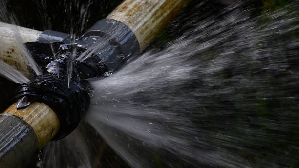 Photography of water spray coming out of a leaking pipe