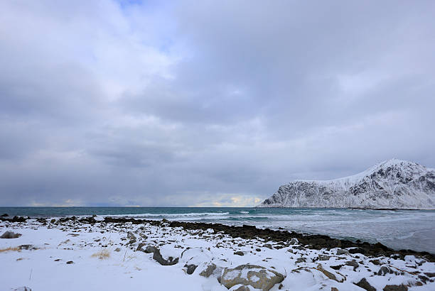 View of lake and mountain landscape in winter of Norway.