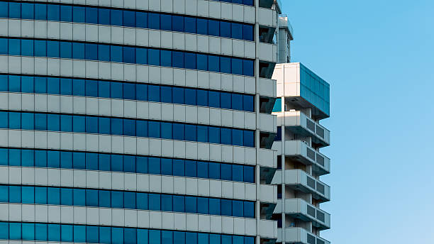 istock many windows and walls facade of a modern skyscraper without people 2210012989