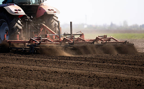 istock Tractor preparing land with seedbed cultivator. 2210014999