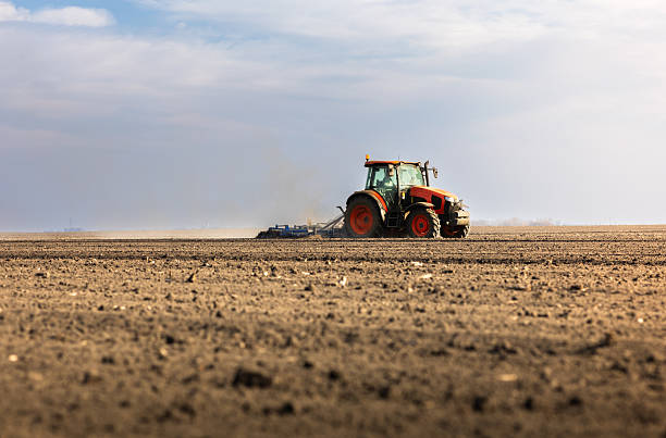 istock Tractor preparing the land for a new crop planting 2210015062