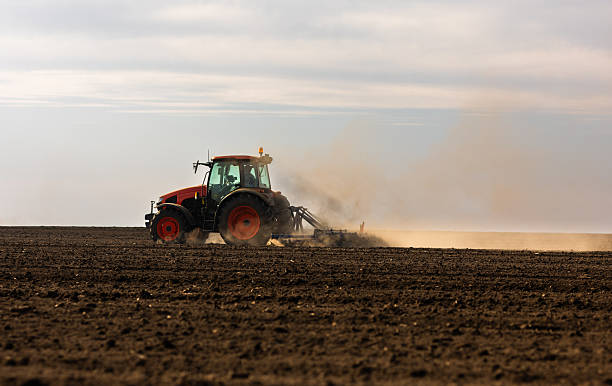 istock Tractor preparing the land for a new crop planting 2210015070