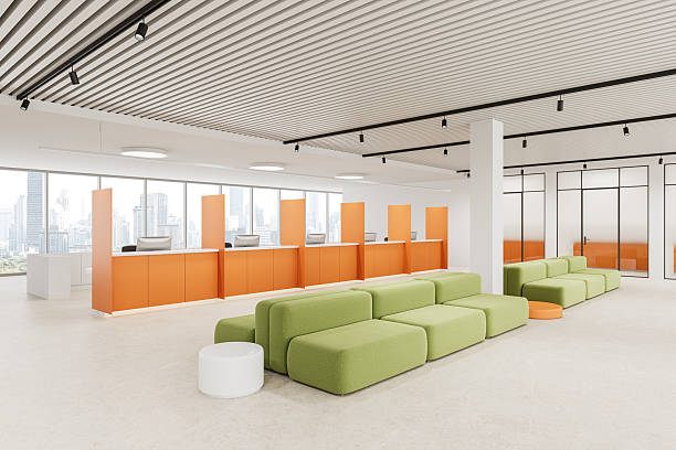 istock Modern bank interior with orange service counters and green seating. 3D Rendering 2210015077