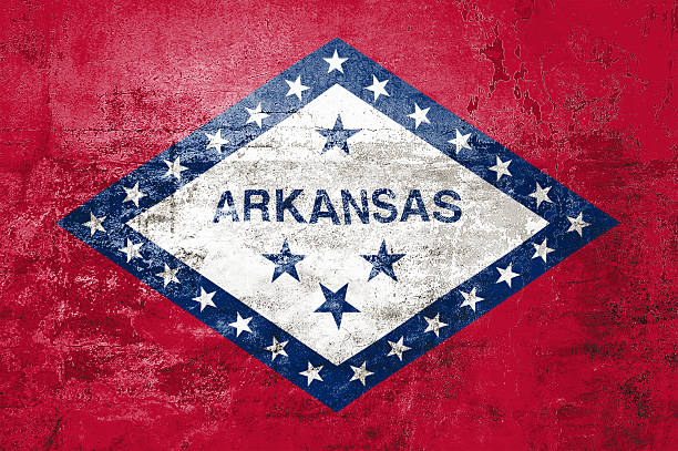 Arkansas State Flag. Dirty Arkansas state flag on the wall. Grunge wall texture