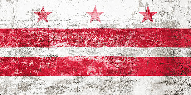 istock Washington D.C State Flag. Dirty Washington D.C state flag on the wall. 2210017570