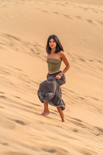 istock Tourist walking on maspalomas dunes in gran canaria 2210018199