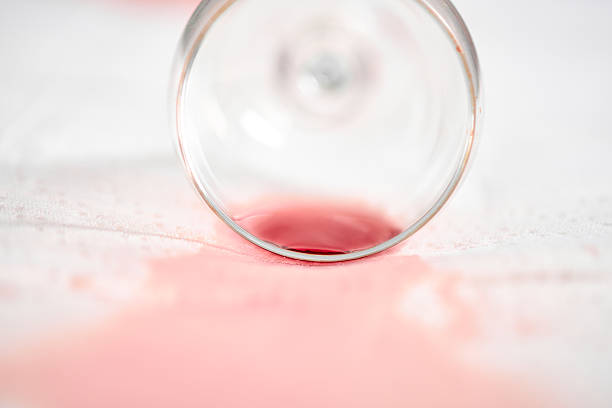 istock Spilled wine glass on white tablecloth 2210023795