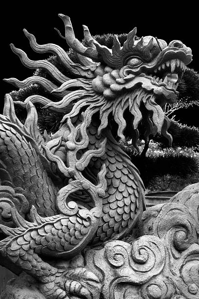 istock Black and white close up image of dragon sculpture 2210023935