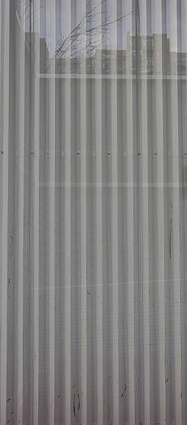 istock Vertical Metal Mesh Pattern with Bright Illumination in a Close-Up View 2210027184