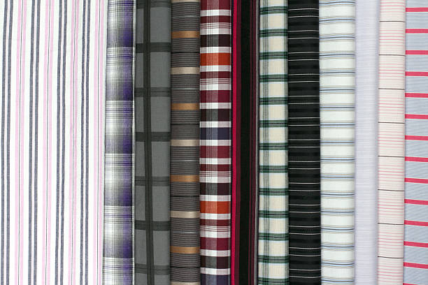 istock Assorted fabric pieces featuring checkered and striped textures in rich colors, great for sewing or textile design. 2210031553