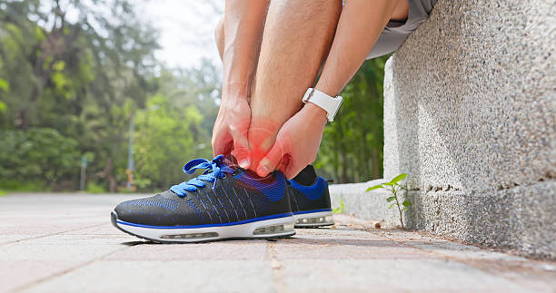 istock asian men sports ankle injury 2210035320